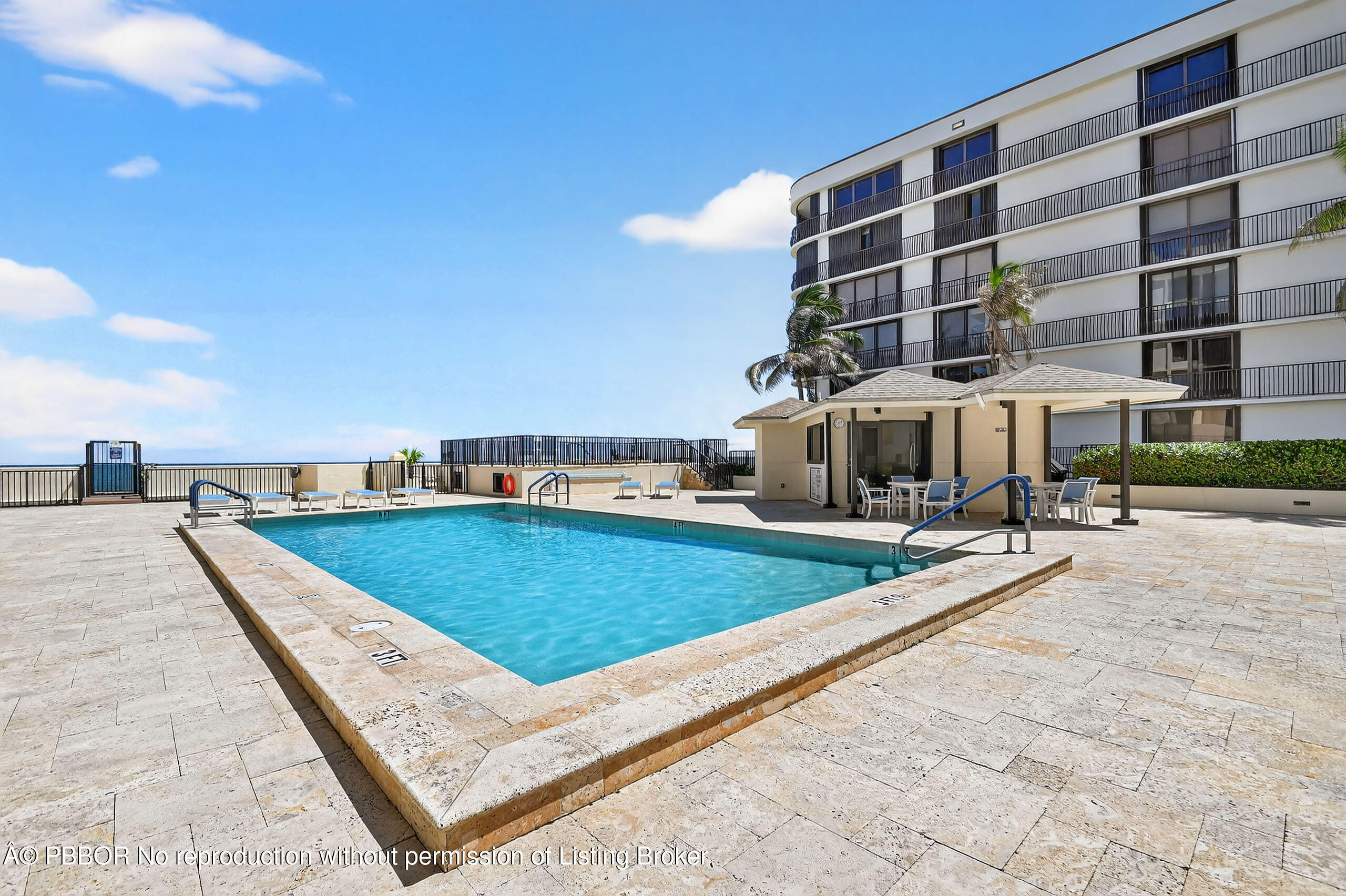 3610 South Ocean Boulevard, Unit 608 Palm Beach, FL 33480 - Photo 27 of 38 a view of a swimming pool with a lounge chair