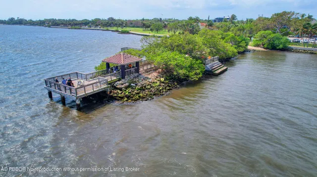 a view of a lake with a bench next to a lake