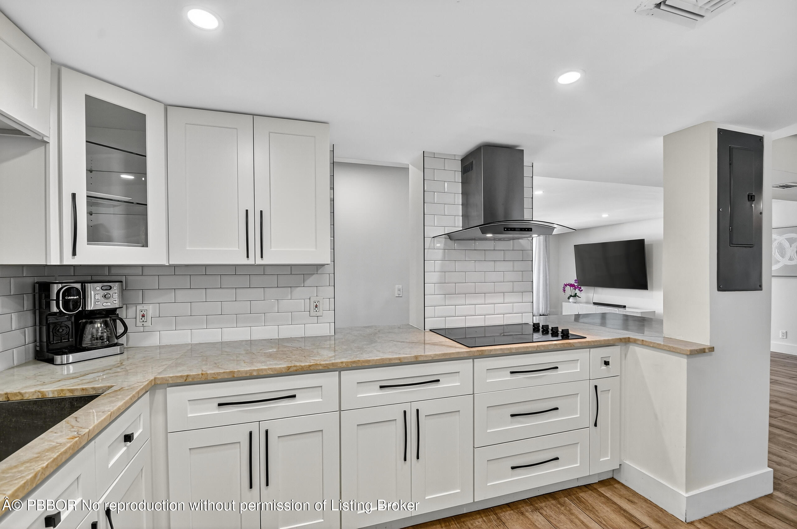 3610 South Ocean Boulevard, Unit 608 Palm Beach, FL 33480 - Photo 5 of 38 a kitchen with white cabinets and sink