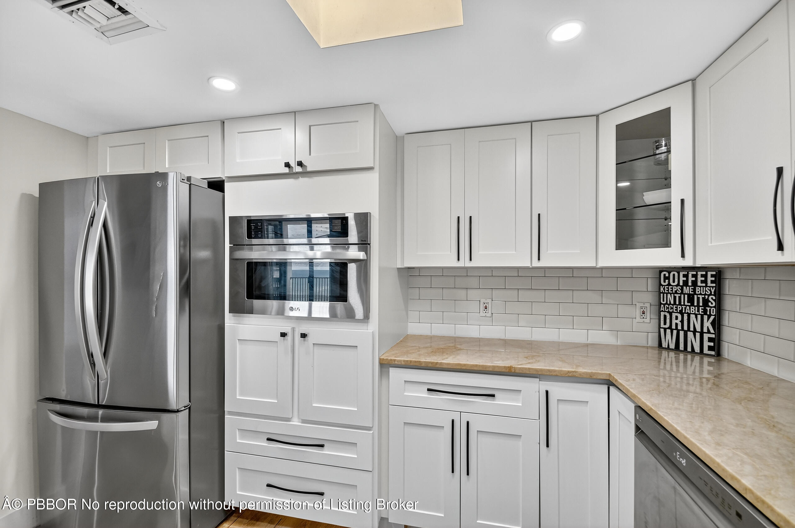 3610 South Ocean Boulevard, Unit 608 Palm Beach, FL 33480 - Photo 6 of 38 a kitchen with refrigerator cabinets and stove