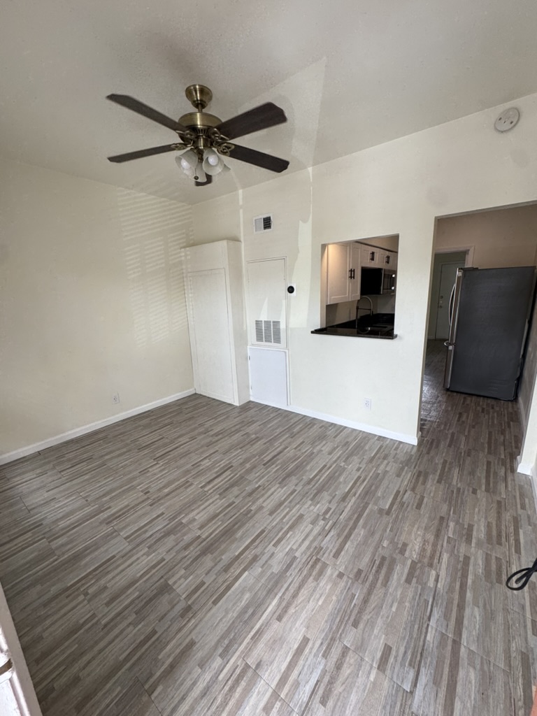 3000 Guadalupe Street, Unit 214 Austin, TX 78705 - Photo 5 of 7 a view of empty room with wooden floor