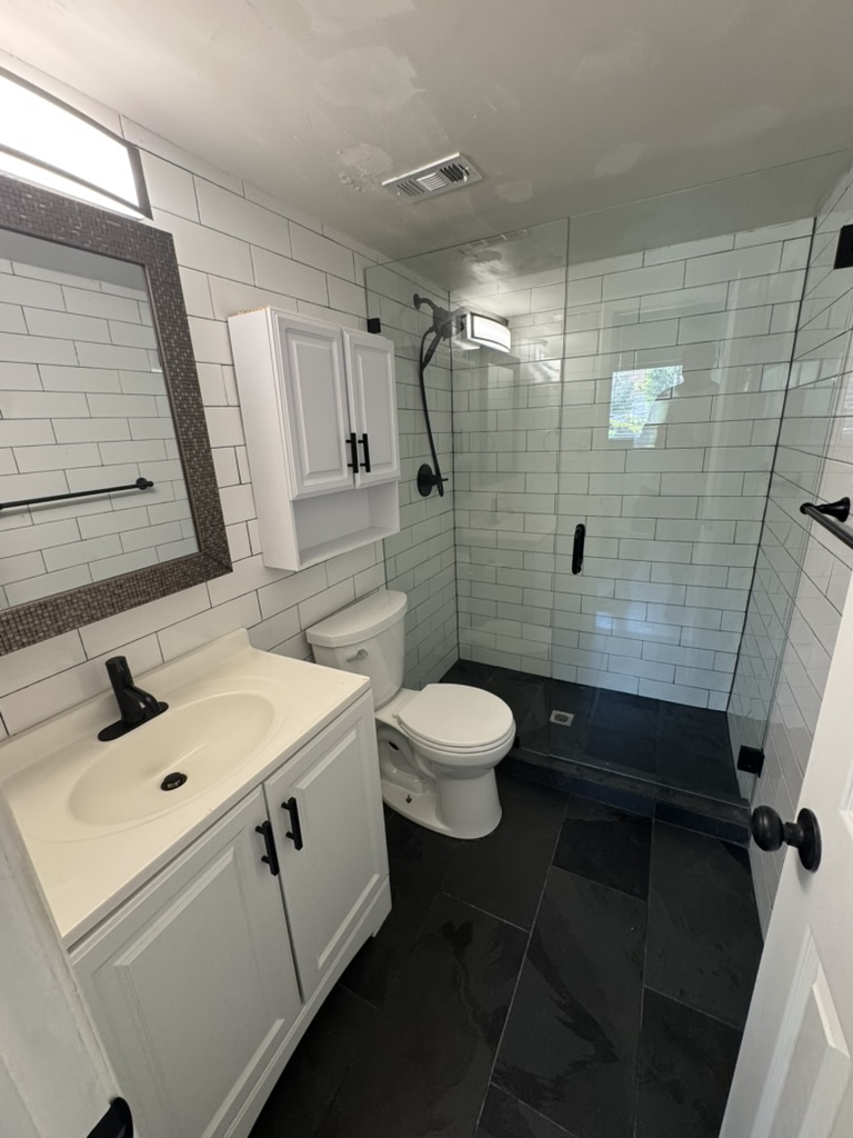 3000 Guadalupe Street, Unit 214 Austin, TX 78705 - Photo 7 of 7 a bathroom with a sink a toilet and shower