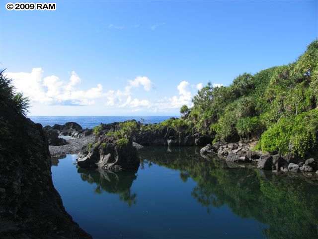 340 Waiohonu Road Hana, HI 96713 - Photo 5 of 6 a view of a lake with a mountain in the background