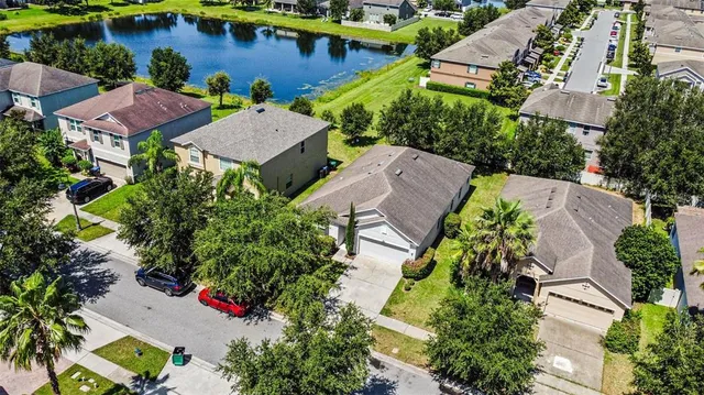 an aerial view of a house with outdoor space