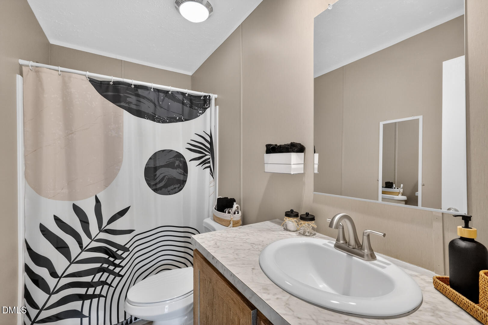 540 Pine Ridge Road Zebulon, NC 27597 - Photo 81 of 96 a bathroom with a sink a mirror and a toilet