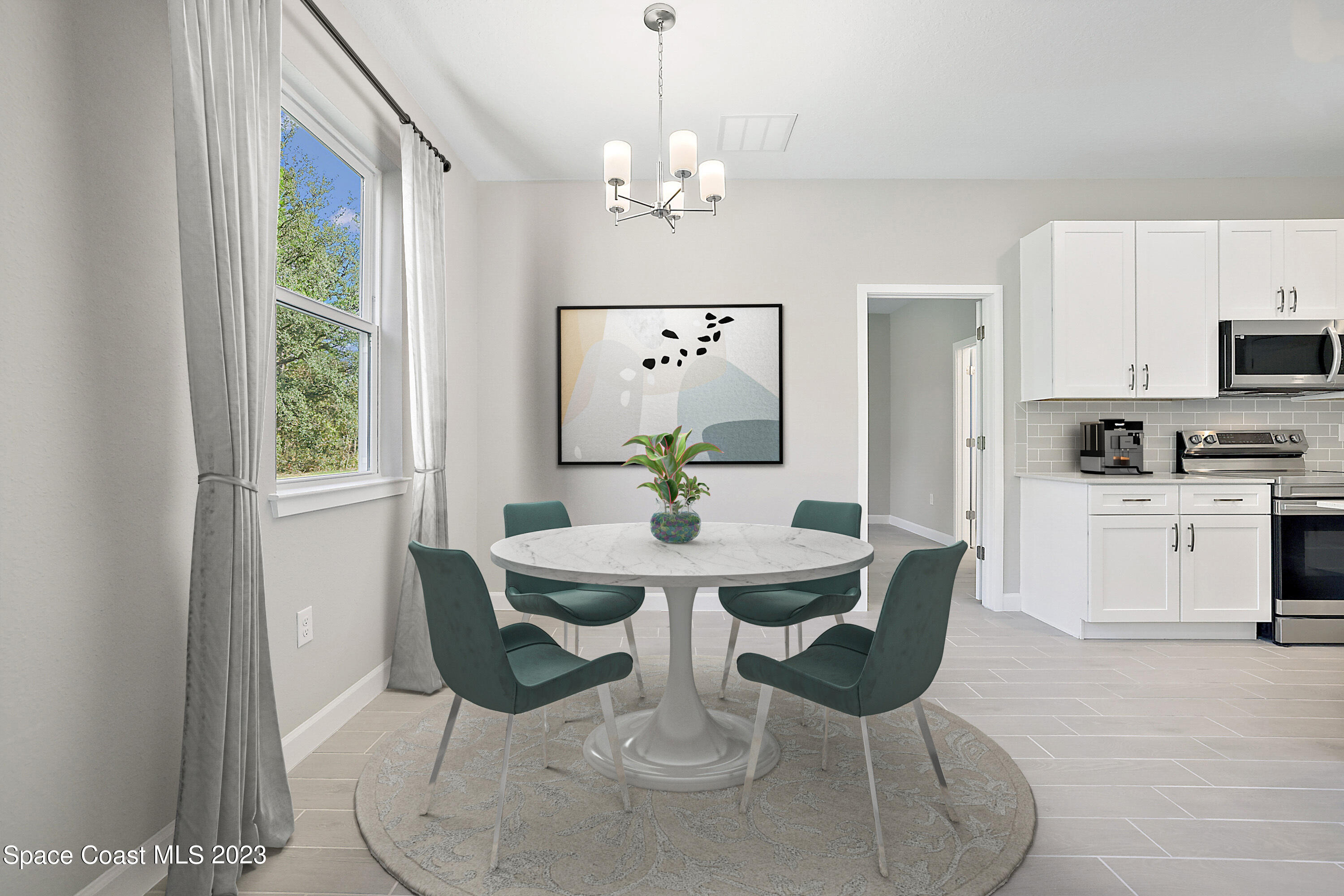 365 Wendover Road Southwest Palm Bay, FL 32908 - Photo 9 of 21 a view of a dining room with furniture window and wooden floor