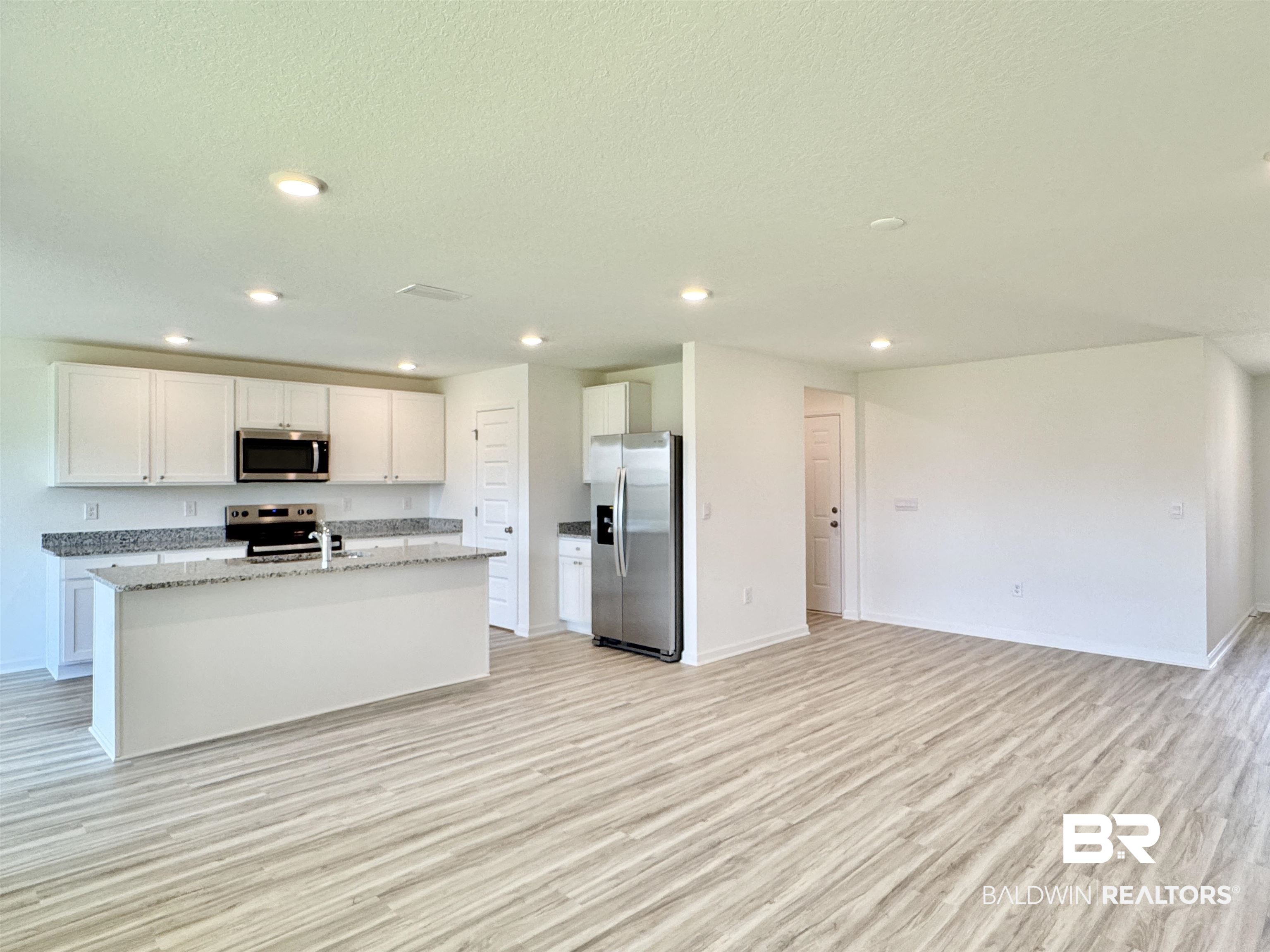 22072 Aleutian Avenue Foley, AL 36535 - Photo 9 of 47 Living space looking towards kitchen island
