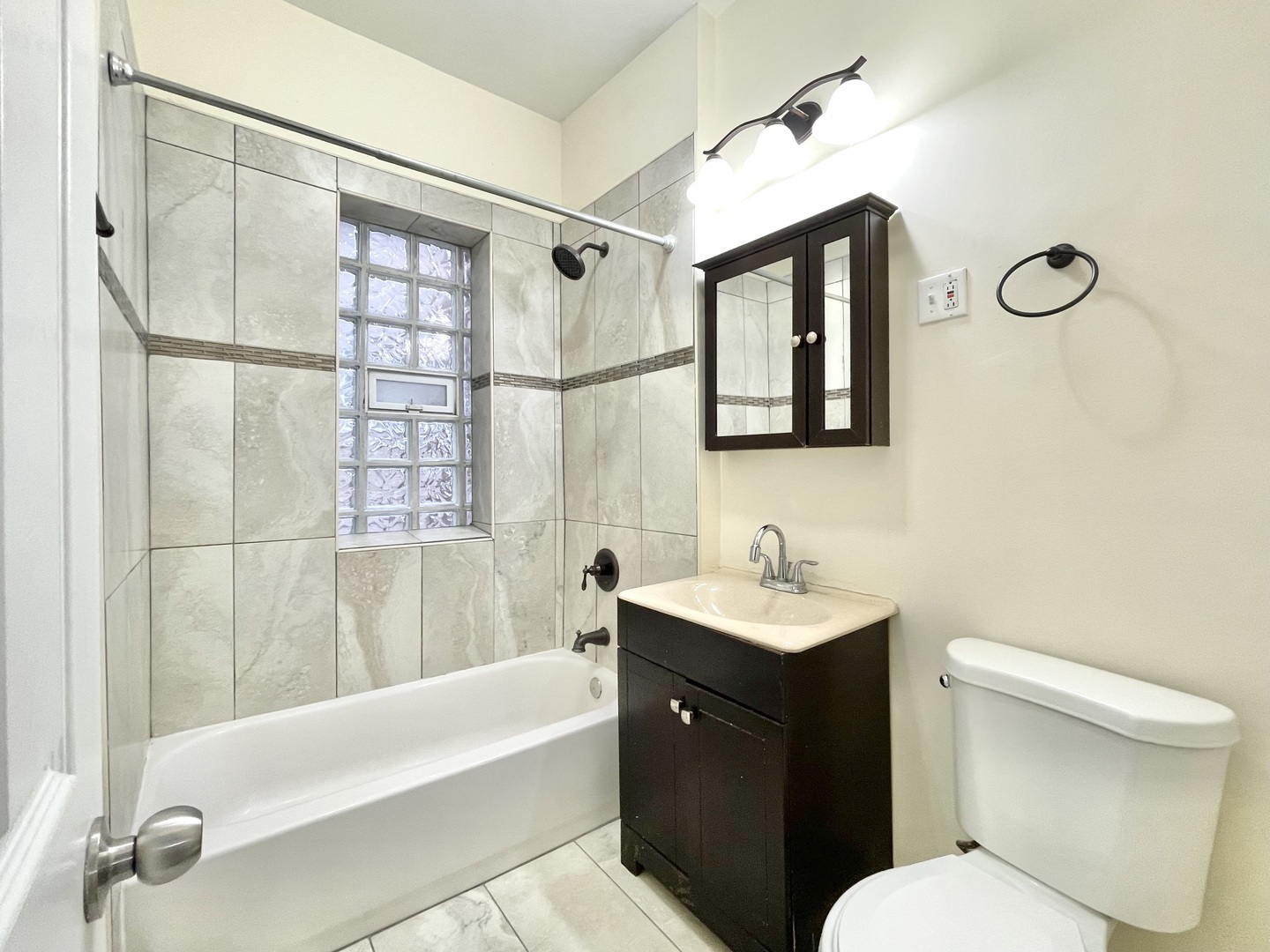 4349 North Spaulding Avenue, Unit 1 Chicago, IL 60618 - Photo 14 of 18 a bathroom with a sink and a mirror