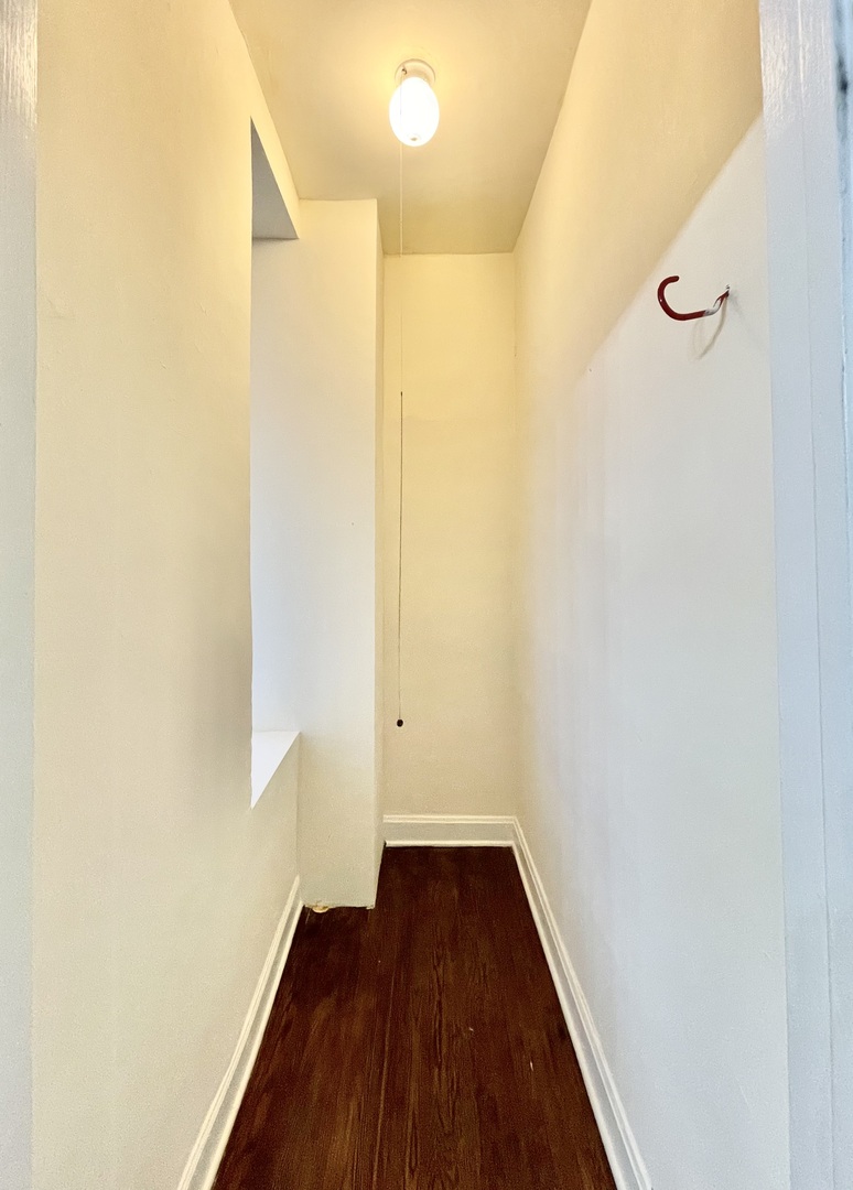 4349 North Spaulding Avenue, Unit 1 Chicago, IL 60618 - Photo 18 of 18 a view of a hallway with wooden floor