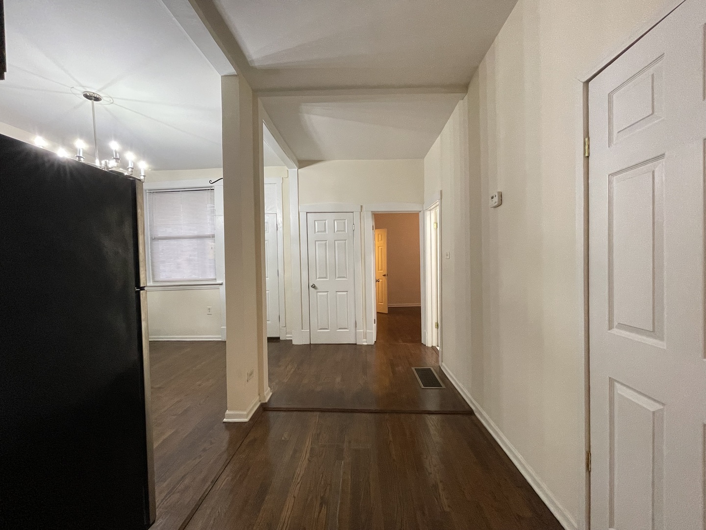 4349 North Spaulding Avenue, Unit 1 Chicago, IL 60618 - Photo 7 of 18 a view of a hallway with wooden floor