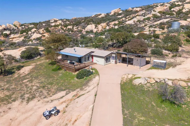 a aerial view of a house with a yard