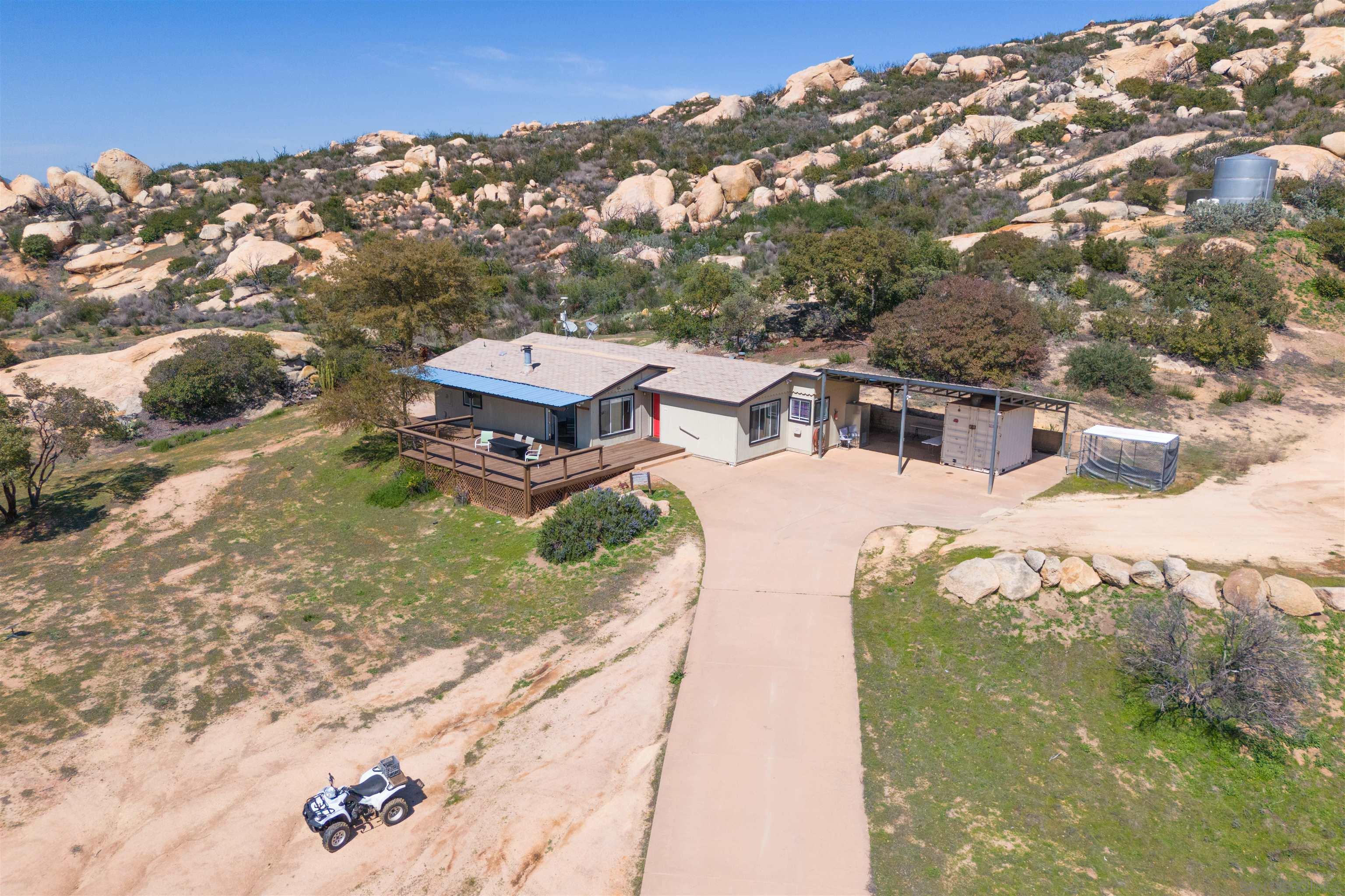 a aerial view of a house with a yard