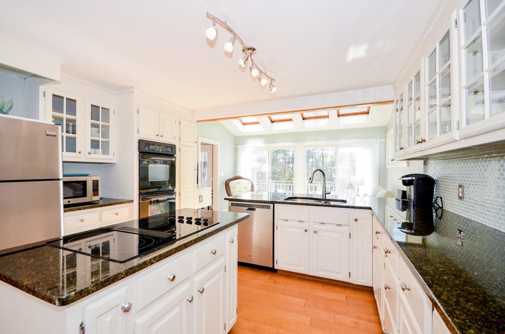 18 Zora Road Marion, MA 02738 - Photo 17 of 37 a kitchen with stainless steel appliances granite countertop a sink stove and refrigerator
