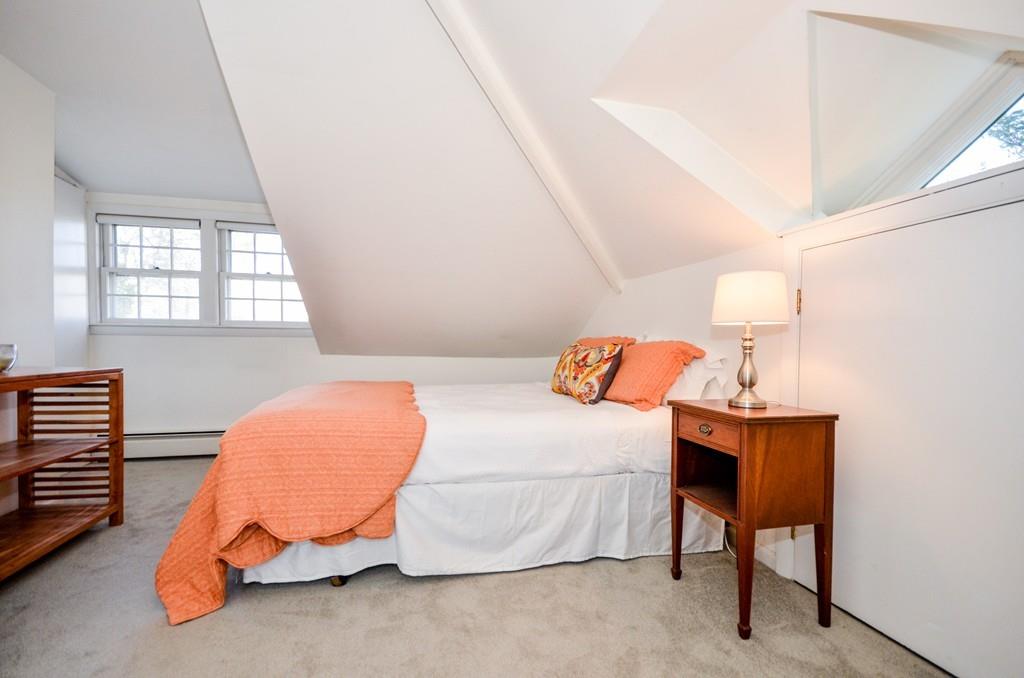 18 Zora Road Marion, MA 02738 - Photo 21 of 37 a bedroom with a bed and a potted plant