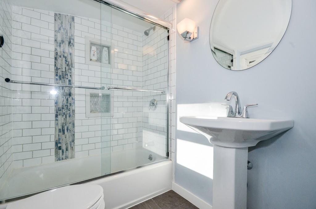 18 Zora Road Marion, MA 02738 - Photo 23 of 37 a bathroom with a sink a toilet and shower