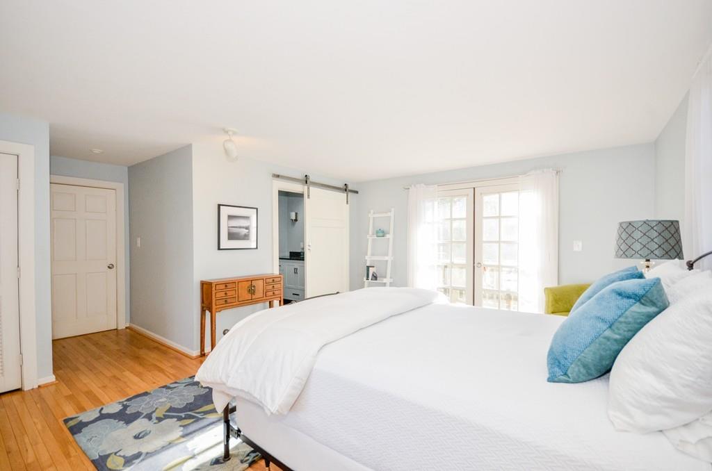 18 Zora Road Marion, MA 02738 - Photo 30 of 37 a bedroom with a bed and wooden floor
