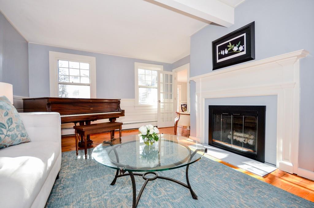 18 Zora Road Marion, MA 02738 - Photo 9 of 37 a living room with furniture and a fireplace