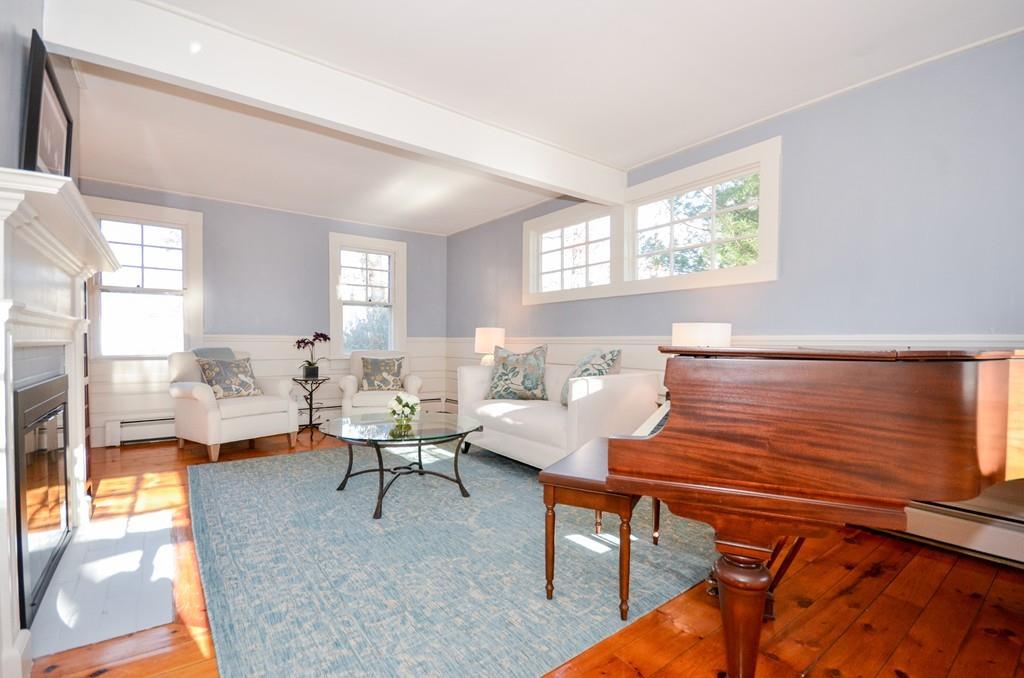 18 Zora Road Marion, MA 02738 - Photo 10 of 37 a living room with furniture and a table