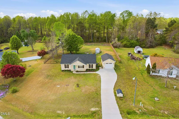 a view of a swimming pool with a yard