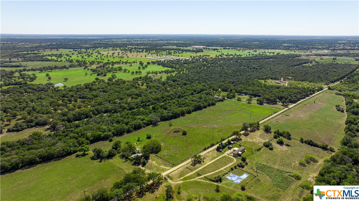 an aerial view of a golf course with a garden