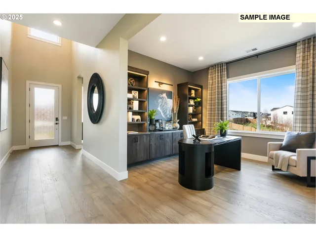 a kitchen with stainless steel appliances a stove top oven a sink dishwasher and a view living room