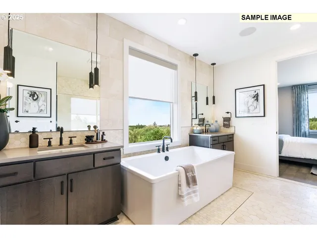 a large white kitchen with a large window