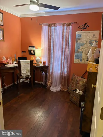 a workspace with furniture and window