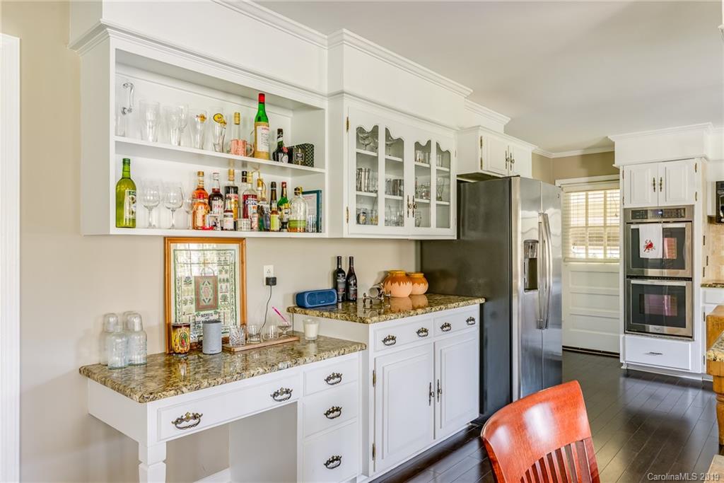 3224 Allenwood Road Charlotte, NC 28270 - Photo 11 of 38 a kitchen with stainless steel appliances granite countertop a refrigerator and a sink
