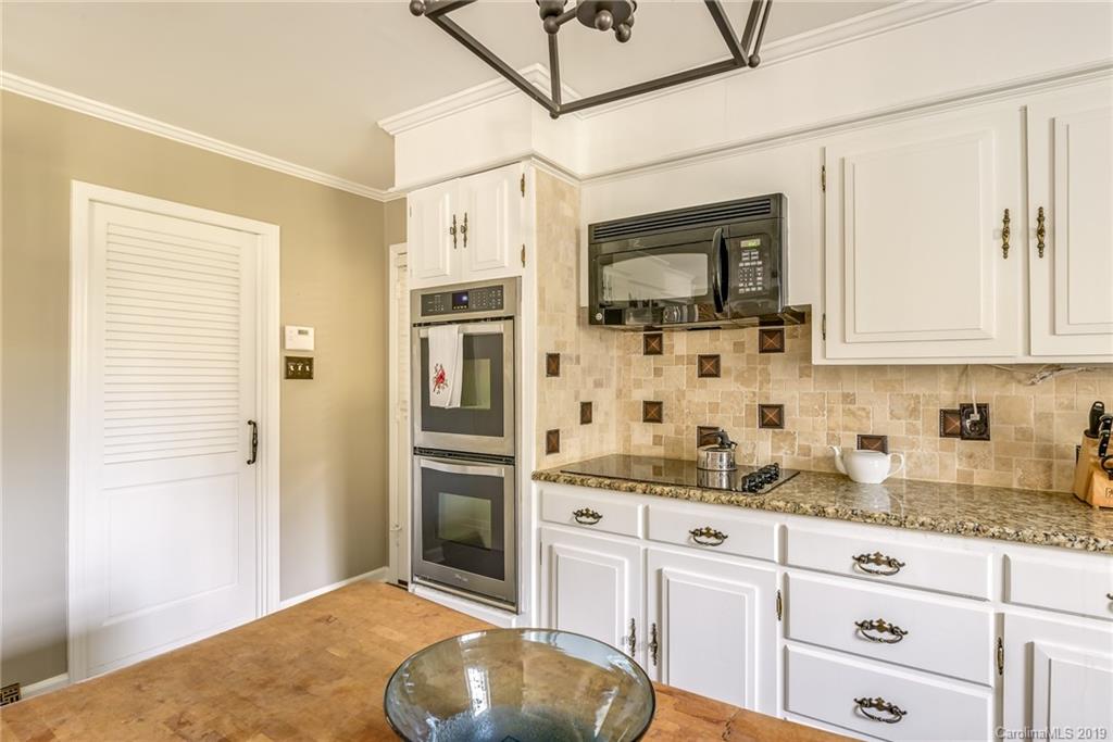 3224 Allenwood Road Charlotte, NC 28270 - Photo 13 of 38 a kitchen with stainless steel appliances a stove a sink and a refrigerator