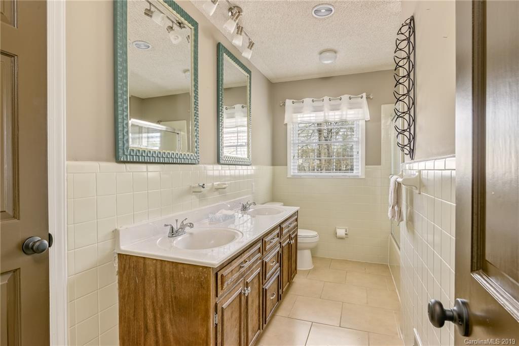 3224 Allenwood Road Charlotte, NC 28270 - Photo 19 of 38 a bathroom with a sink and a mirror
