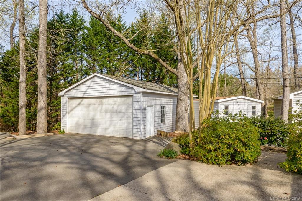 3224 Allenwood Road Charlotte, NC 28270 - Photo 23 of 38 a front view of a house with a yard and garage