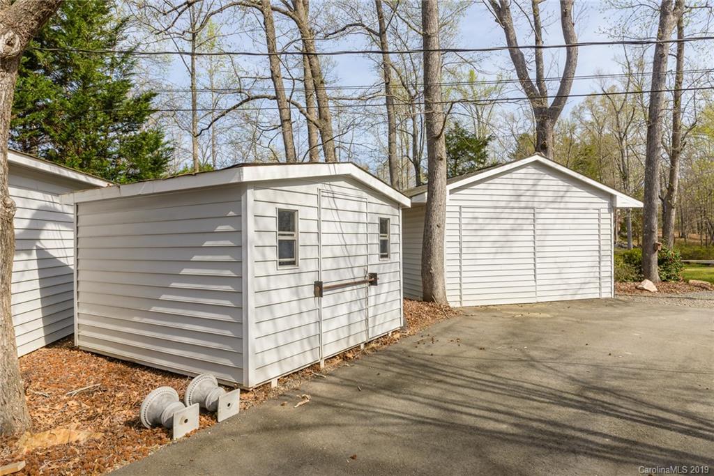 3224 Allenwood Road Charlotte, NC 28270 - Photo 25 of 38 a view of a house with a yard and garage