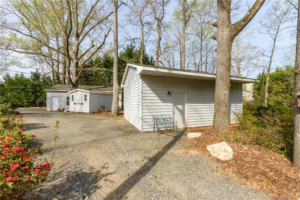 3224 Allenwood Road Charlotte, NC 28270 - Photo 26 of 38 a view of a house with a yard and garage