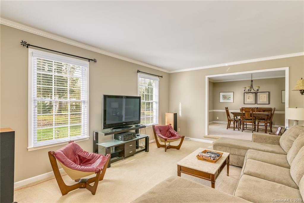 3224 Allenwood Road Charlotte, NC 28270 - Photo 4 of 38 a living room with furniture or couch and a flat screen tv