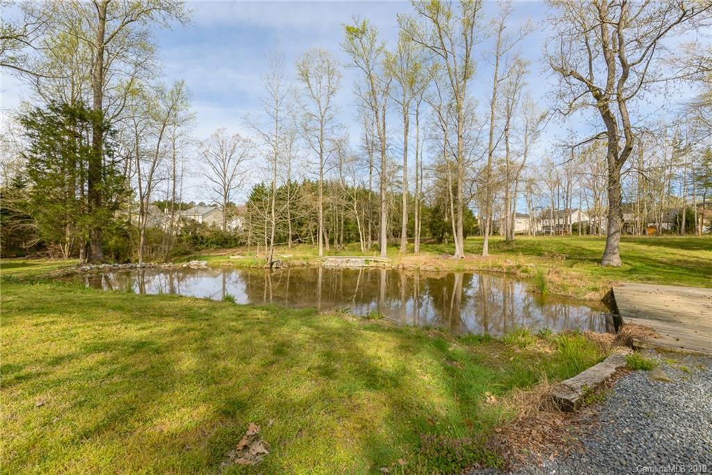 3224 Allenwood Road Charlotte, NC 28270 - Photo 31 of 38 a swimming pool with outdoor seating and yard