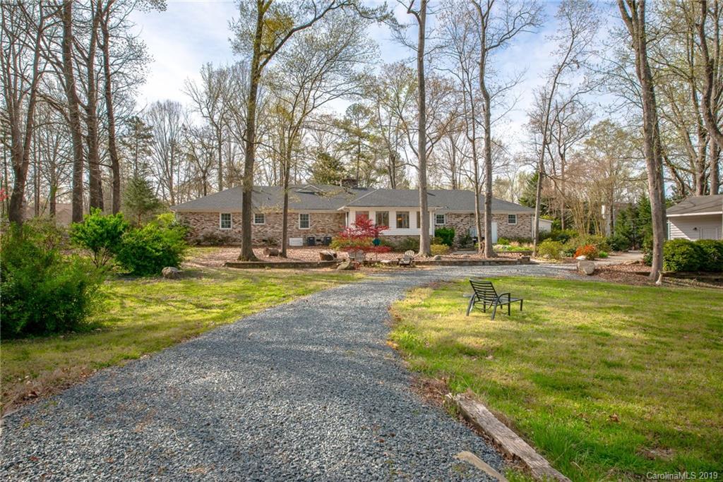 3224 Allenwood Road Charlotte, NC 28270 - Photo 34 of 38 a view of swimming pool with outdoor seating and trees in the background