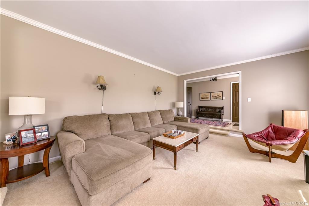 3224 Allenwood Road Charlotte, NC 28270 - Photo 5 of 38 a living room with furniture and a potted plant