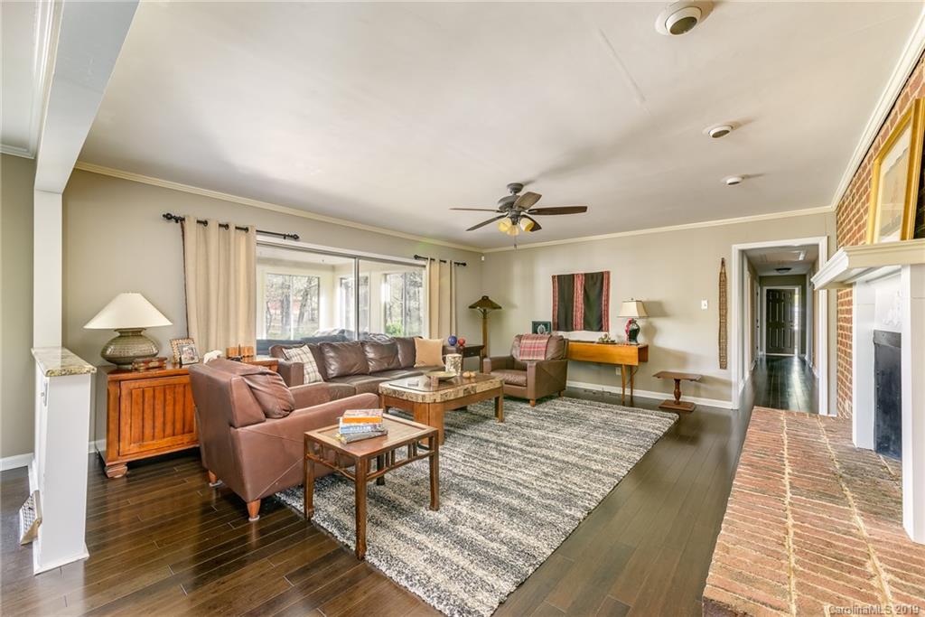 3224 Allenwood Road Charlotte, NC 28270 - Photo 7 of 38 a living room with furniture and a fireplace