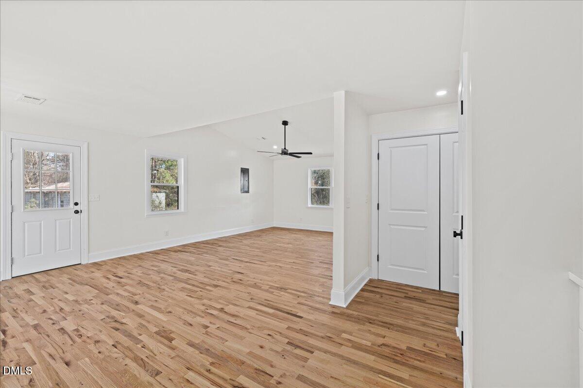 598 Bentonville Road Four Oaks, NC 27524 - Photo 19 of 40 a view of empty room with wooden floor