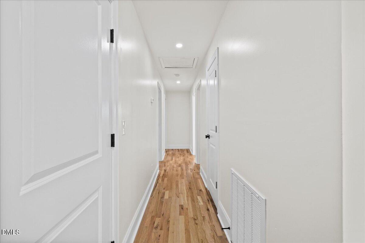 598 Bentonville Road Four Oaks, NC 27524 - Photo 21 of 40 a view of a hallway with a white walls