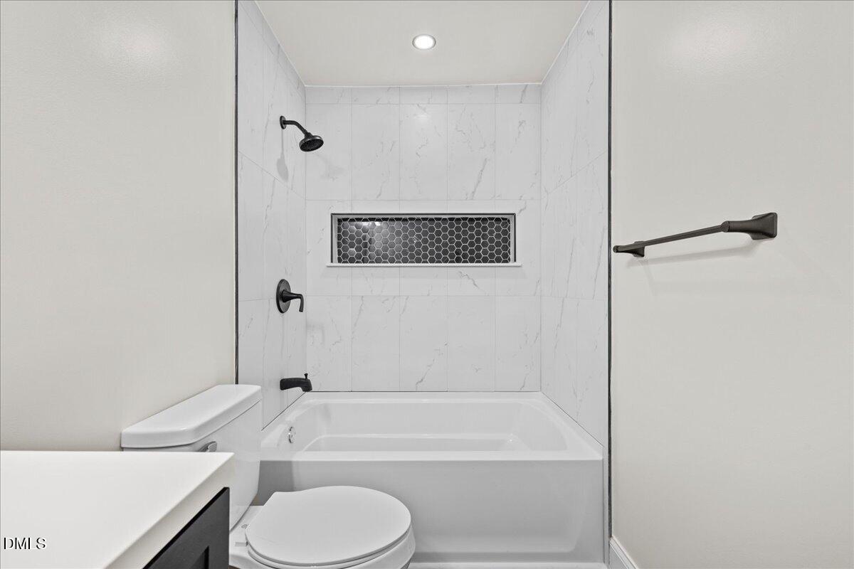 598 Bentonville Road Four Oaks, NC 27524 - Photo 23 of 40 a bathroom with a toilet a sink and bathtub