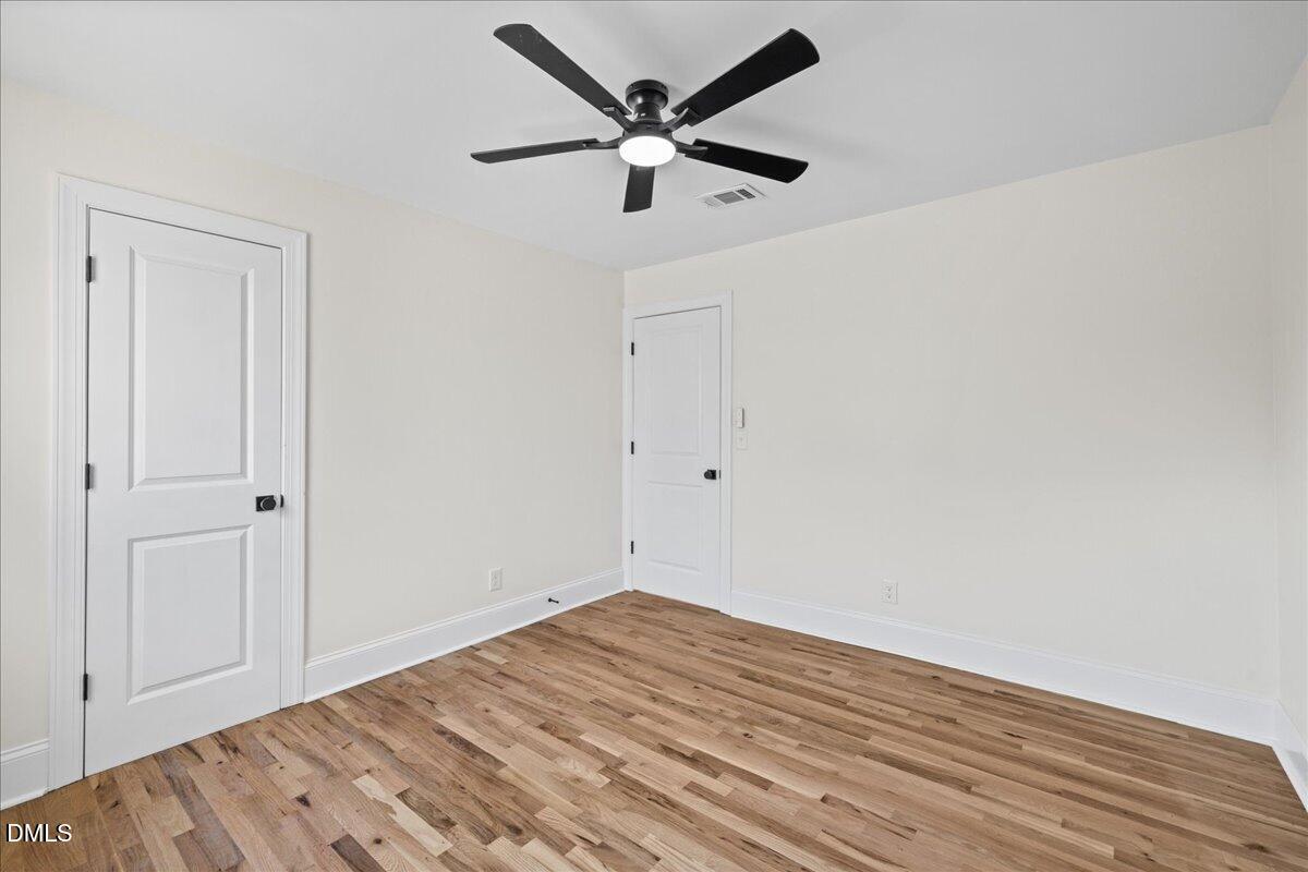 598 Bentonville Road Four Oaks, NC 27524 - Photo 25 of 40 a view of empty room with wooden floor