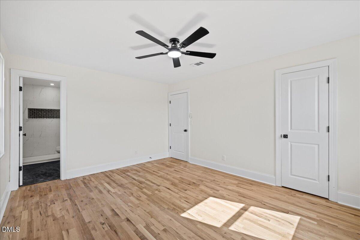598 Bentonville Road Four Oaks, NC 27524 - Photo 28 of 40 a view of a livingroom with a ceiling fan