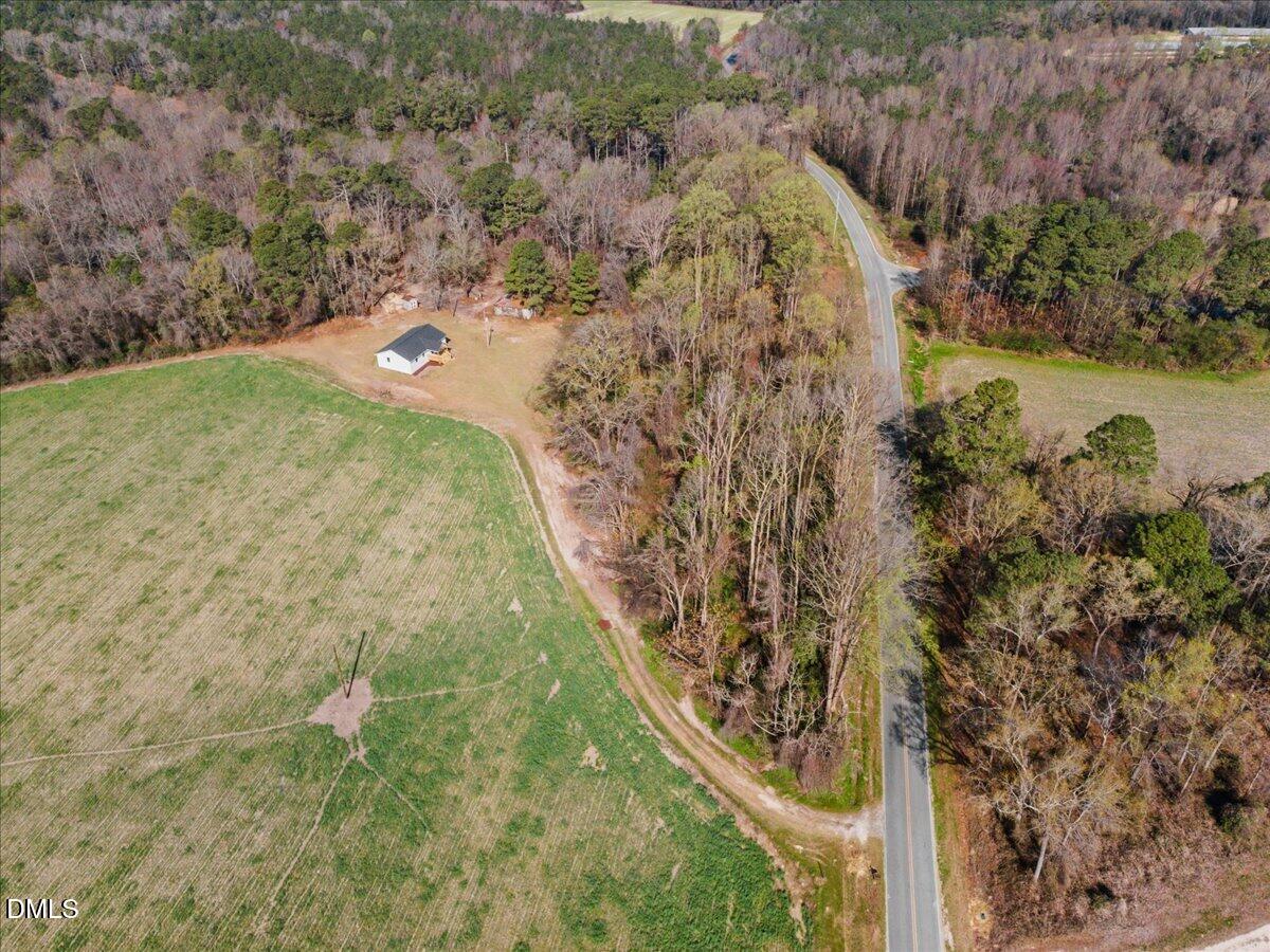 598 Bentonville Road Four Oaks, NC 27524 - Photo 37 of 40 a view of a yard with plants