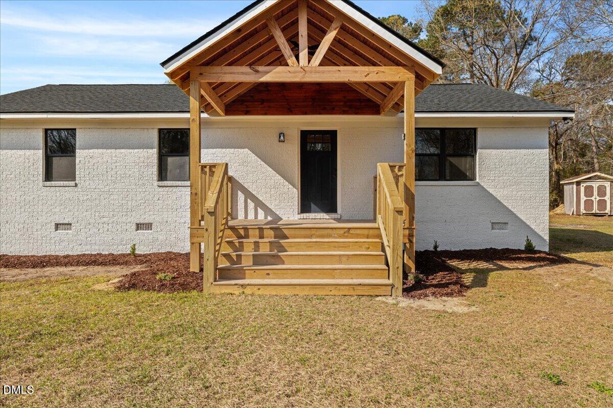 598 Bentonville Road Four Oaks, NC 27524 - Photo 5 of 40 a front view of a house with a yard