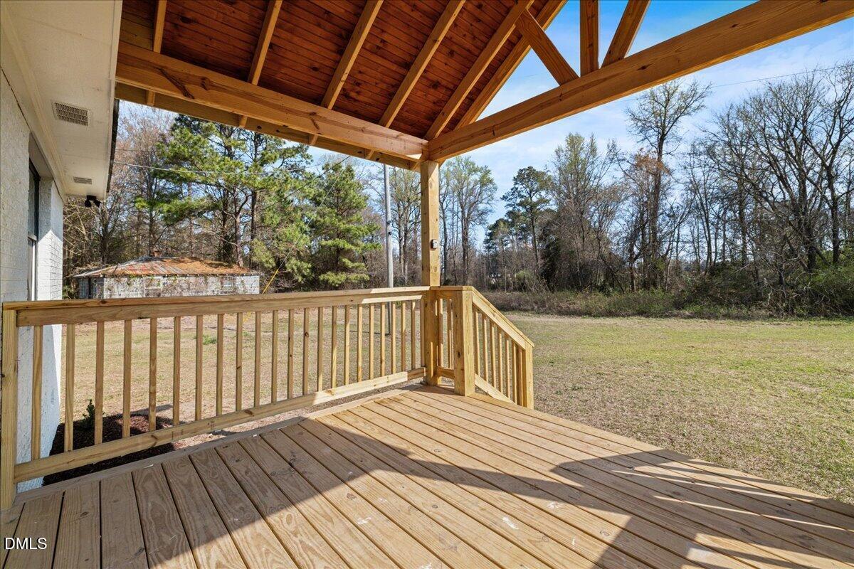 598 Bentonville Road Four Oaks, NC 27524 - Photo 7 of 40 a view of a wooden deck