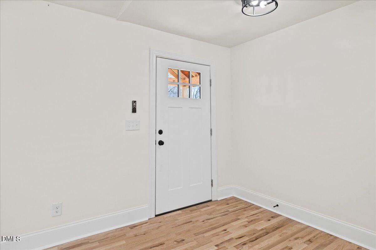 598 Bentonville Road Four Oaks, NC 27524 - Photo 8 of 40 a view of an empty room