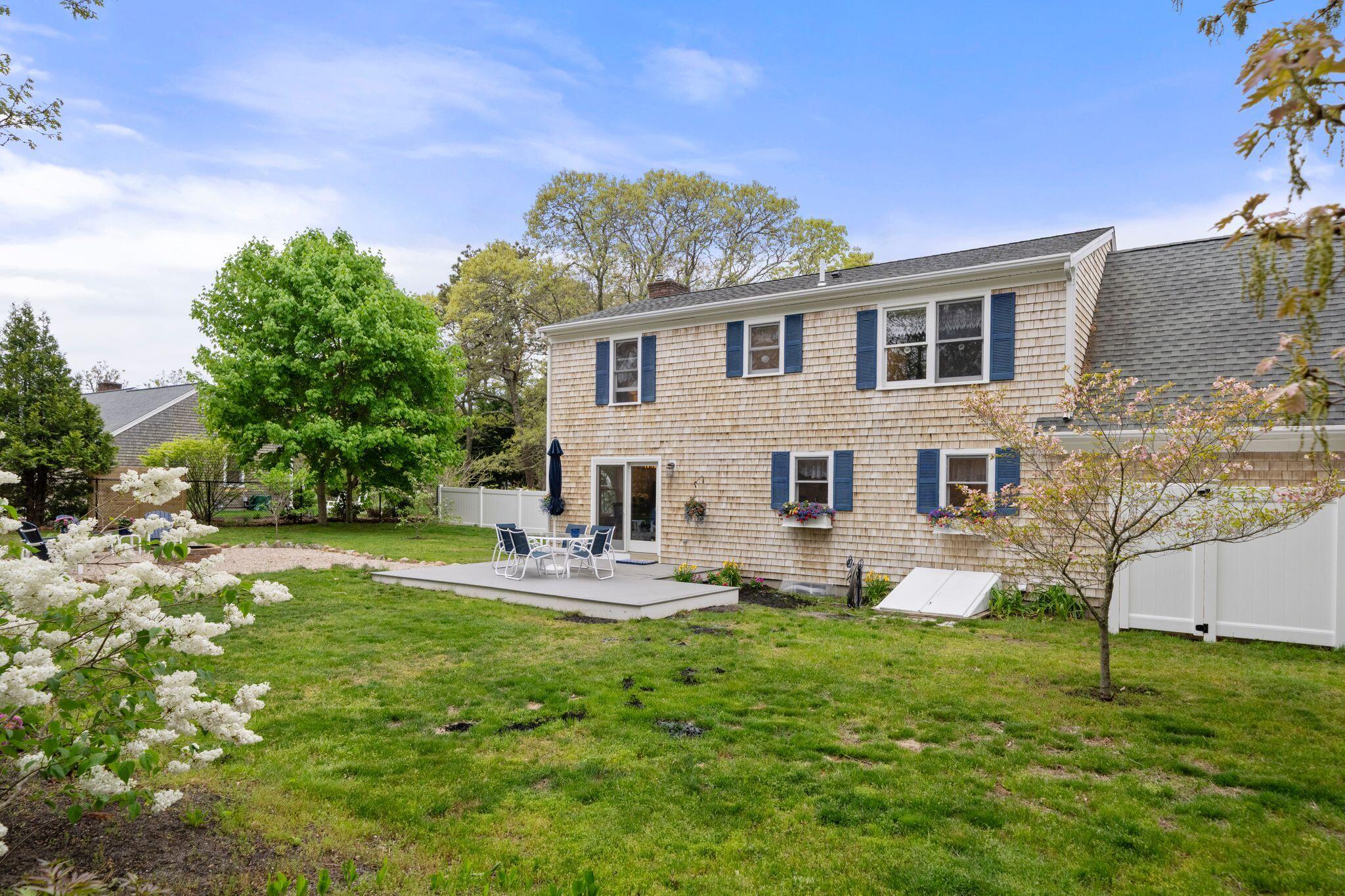 40 Sam Ryder Road Chatham, MA 02633 - Photo 3 of 42 a front view of a house with garden