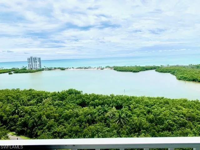 a view of a lake with houses in the back