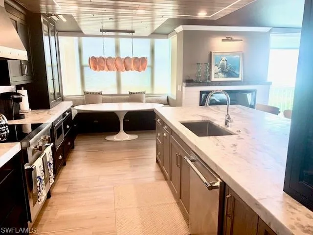 a kitchen with a stove a sink and a refrigerator